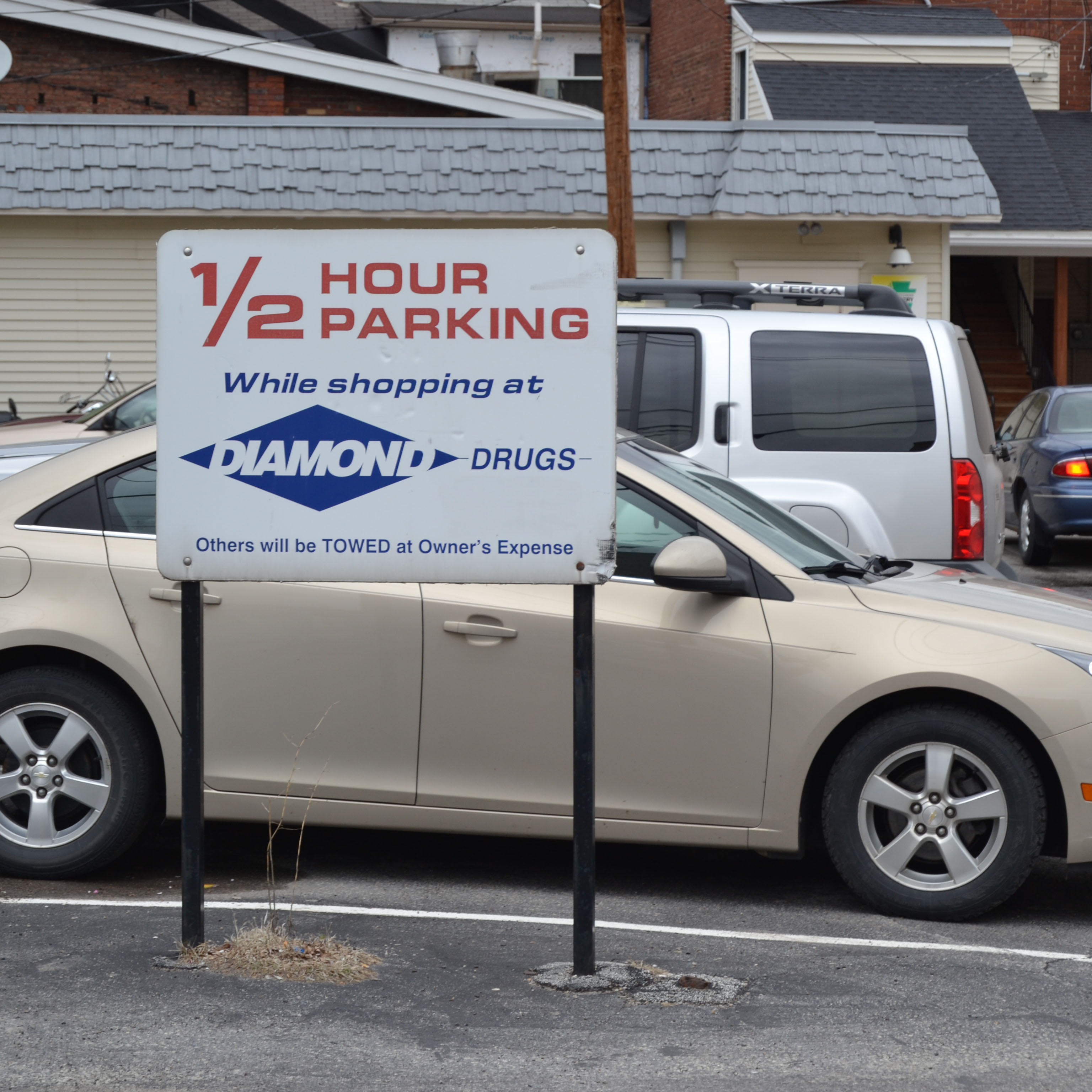 Half hour parking sign in drug store parking lot