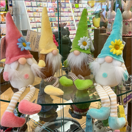 Gnome decorations on glass shelf